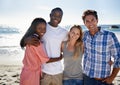 Double beach date. Cropped portrait of two happy couples enjoying a day at the beach. Royalty Free Stock Photo