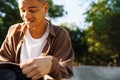 Cropped portrait of young handsome confused boy looking in backpack Royalty Free Stock Photo