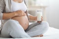Cropped of pregnant woman holding glass of milk Royalty Free Stock Photo