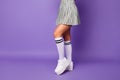 Cropped profile photo of lady showing cool stylish clothes outfit fit slim legs wear short plaid skirt long knee socks