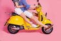 Cropped profile side view portrait of his he her she nice young couple riding moped without legs having fun enjoying Royalty Free Stock Photo