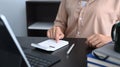 Accountant working with digital tablet and calculate business data at office desk. Royalty Free Stock Photo