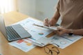 Cropped shot of accountants work analyzing financial reports on a laptop at his office, business analytics concept Royalty Free Stock Photo