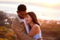 Nowhere else Id rather be. Cropped shot of an affectionate young couple embracing lovingly at sunset. Royalty Free Stock Photo