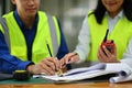 Cropped shot of architects man and woman working on blueprint and discussing the new project in office Royalty Free Stock Photo