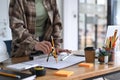 Architects woman working with blueprints in the office. Royalty Free Stock Photo