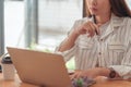 Cropped shot of asian accountant woman working on desk office and drinking a coffee.asian woman working concept Royalty Free Stock Photo