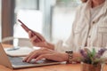 Cropped shot of asian accountant woman working on desk office and drinking a coffee.asian woman working concept Royalty Free Stock Photo