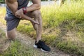 Cropped shot of an athletic man having calf muscle cramps. Endurance issues during outdoor run