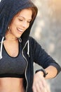 Beating her previous best. Cropped shot of an attractive young athlete checking her watch after an outdoor workout. Royalty Free Stock Photo