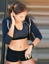 Did I beat my time. Cropped shot of an attractive young athlete checking her watch after an outdoor workout. Royalty Free Stock Photo