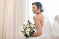 Radiantly beautiful on her wedding day. Cropped shot of an attractive young bride sitting alone in the dressing room and Royalty Free Stock Photo