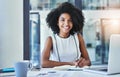 All in the name of business. Cropped shot of an attractive young businesswoman working in her office. Royalty Free Stock Photo