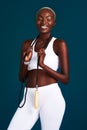 Staying fit keeps me happy. Cropped shot of an attractive young sportswoman standing alone and posing with a jump rope Royalty Free Stock Photo