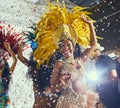 To having the time of our lives. Cropped shot of beautiful samba dancers performing in a carnival with their band. Royalty Free Stock Photo