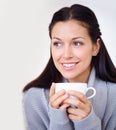 I have a feeling its going to be a good day.... Cropped shot of a beautiful young woman enjoying a cup of coffee in the Royalty Free Stock Photo