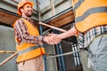 cropped shot of builders shaking hands Royalty Free Stock Photo