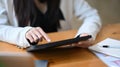 Business woman checking news on digital tablet. Royalty Free Stock Photo