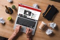 cropped shot of businessman breaking pencil at workplace while looking at bbc website on screen Royalty Free Stock Photo