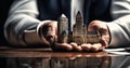 cropped shot of businessman holding model of fairytale castle in hands