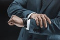 cropped shot of businessman in suit checking time on watch Royalty Free Stock Photo
