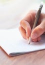 Getting his thoughts down on paper. Cropped shot of a businessman writing on a notepad. Royalty Free Stock Photo