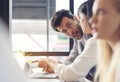 Cropped shot of businesspeople using graph chart and computer laptop, tablet discussing about business plan together in modern Royalty Free Stock Photo