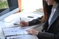 Businesswoman checking financial reports at office. Royalty Free Stock Photo