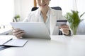 Businesswoman holding credit card and making banking online with digital tablet. Royalty Free Stock Photo