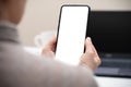 Cropped shot of businesswoman looking at blank screen smartphone in modern office room. woman hand holding phone with white screen Royalty Free Stock Photo