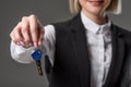 cropped shot of businesswoman showing keys from house in hand Royalty Free Stock Photo