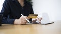 Businesswoman using tablet computer and holding credit card for online banking or online shopping. Royalty Free Stock Photo