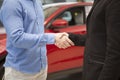 Car dealer selling new autos at the dealership Royalty Free Stock Photo