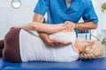 cropped shot of chiropractor massaging back of patient that lying on massage table Royalty Free Stock Photo