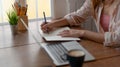 Cropped shot of college girl concentrating on her assignment with laptop