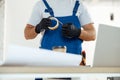 Cropped shot of contractor, professional electrician using duct tape for installing new electrical socket outlet Royalty Free Stock Photo