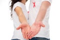 Couple in white t-shirts with aids ribbons