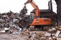 The scrapyard. Cropped shot of an excavator sorting through a pile of scrap metal. Royalty Free Stock Photo