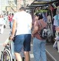 cropped shot of father carrying wheelchair with cute little daughter using laptop at home