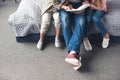 cropped shot of father and kids reading book together