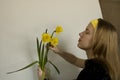 bouquet of yellow daffodils w lush buds. Woman with spring flowers. copy space for text. Royalty Free Stock Photo