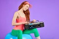 Cropped shot of fit and beautiful woman with portable cassette player Royalty Free Stock Photo