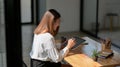 Cropped shot of freelancer working on digital tablet in simple working place Royalty Free Stock Photo