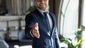 Cropped shot of friendly man recruiter stretching hand to camera Royalty Free Stock Photo