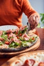 Cropped shot of Girl taking slice of pepperoni pizza Royalty Free Stock Photo