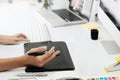 graphic design desk hand using mouse pan sketch device. Royalty Free Stock Photo