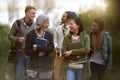 Chatting on the way to class. Cropped shot of a group of college students on campus. Royalty Free Stock Photo