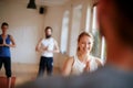 It is code for I do yoga. Cropped shot of a group of people attending a yoga class. Royalty Free Stock Photo