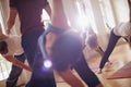 Experience a sense of freedom through movement. Cropped shot of a group of people attending a yoga class. Royalty Free Stock Photo