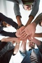 Many hands make light work. Cropped shot of a group of people stacking their hands on top of each other. Royalty Free Stock Photo